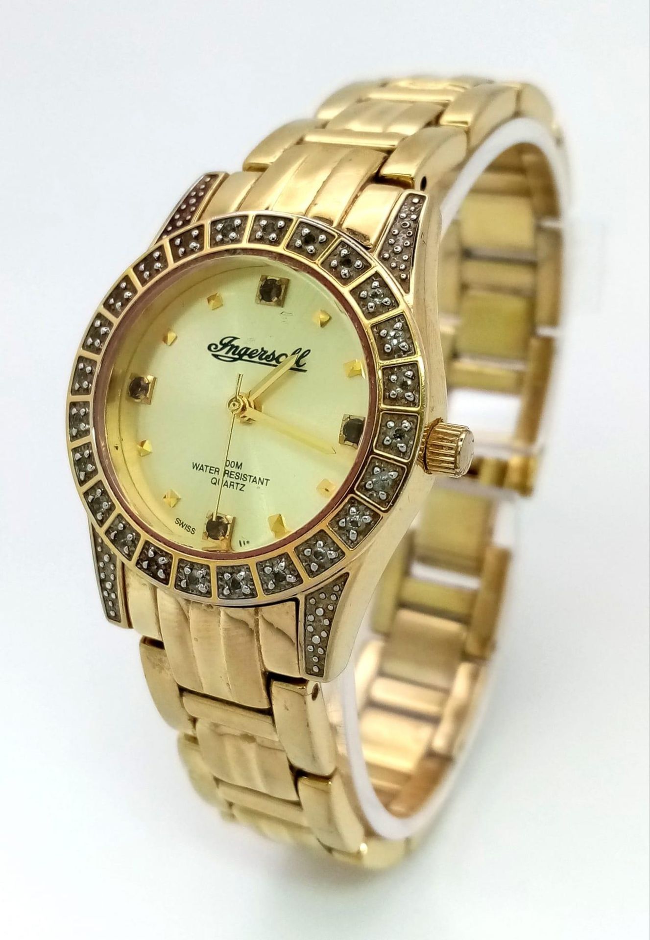An Ingersoll Gold Plated Ladies Quartz Watch. Gold plated bracelet and case - 28mm. Gold tone dial