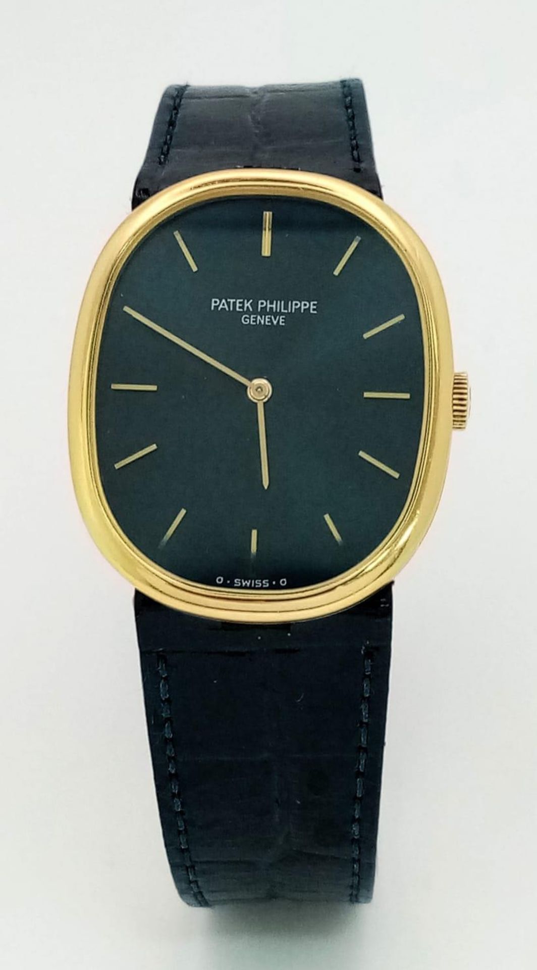 A PATEK PHILIPPE 18K GOLD LADIES WATCH ON ORIGINAL BLUE LEATHER STRAP THAT MATCHES THE STUNNING BLUE