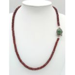 A 125ct Spessartite garnet Necklace with Emerald and 925 silver Clasp. 42cm.