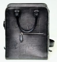 A Berluti Black Leather Satchel. Exterior in scritto leather design with zipped pocket. Spacious