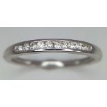 18k white gold diamond channel set half eternity ring, size L, weight 1.6g (dia:0.10ct)