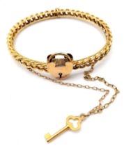 AN ANTIQUE 15K GOLD LINK BANGLE WITH HEART PADLOCK , KEY AND SAFETY CHAIN . 12.9gms