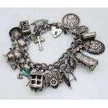 A Vintage 925 Sterling Silver Charm Bracelet with Heart Clasp. Twenty charms including: Knight's