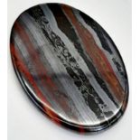 A palaeontological gem, a BANDED IRON FORMATION oval cabochon from Western Australia. Dimensions: