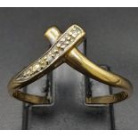 A Vintage 9K Yellow Gold Diamond Crossover Ring. Size P. 1.36g total weight.