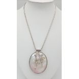 A sterling silver snake chain with a very unusual large pendant made with Mother of Pearl and