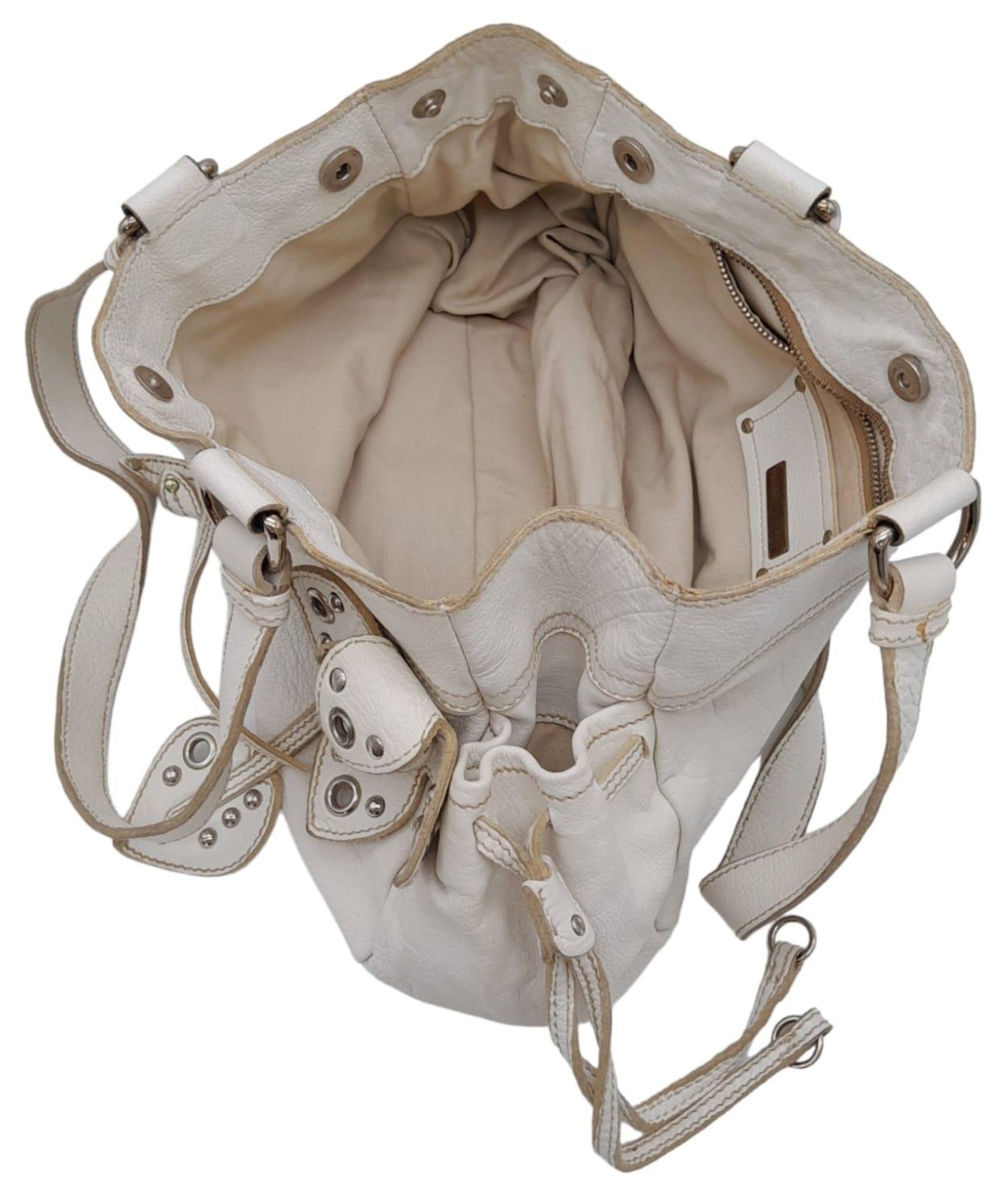 A Miu Miu White Leather Handbag. Ruffled white leather exterior with zipped pocket. Silver-tone - Image 6 of 8
