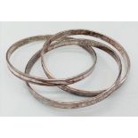 Three sterling silver interlocked bangles, marked TIFFANY & Co, internal diameter 65 mm, total