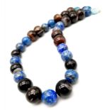 A Large Bead Lapis Lazuli and Onyx Necklace. 15 and 20mm beads. 46cm necklace length.