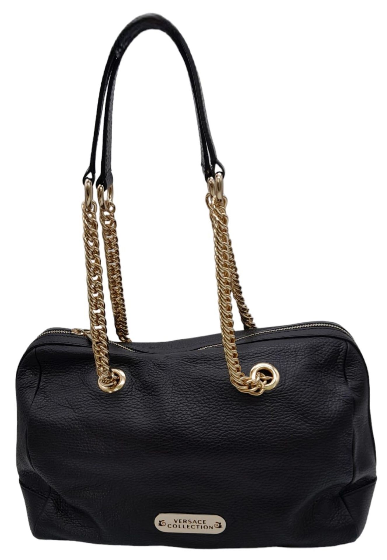 A Versace Collection Black Textured Leather Handbag. Black leather exterior with gilded main zip.