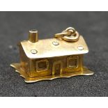 9K YELLOW GOLD HOUSE CHARM WHICH OPENS TO REVEAL A BED 2.7G