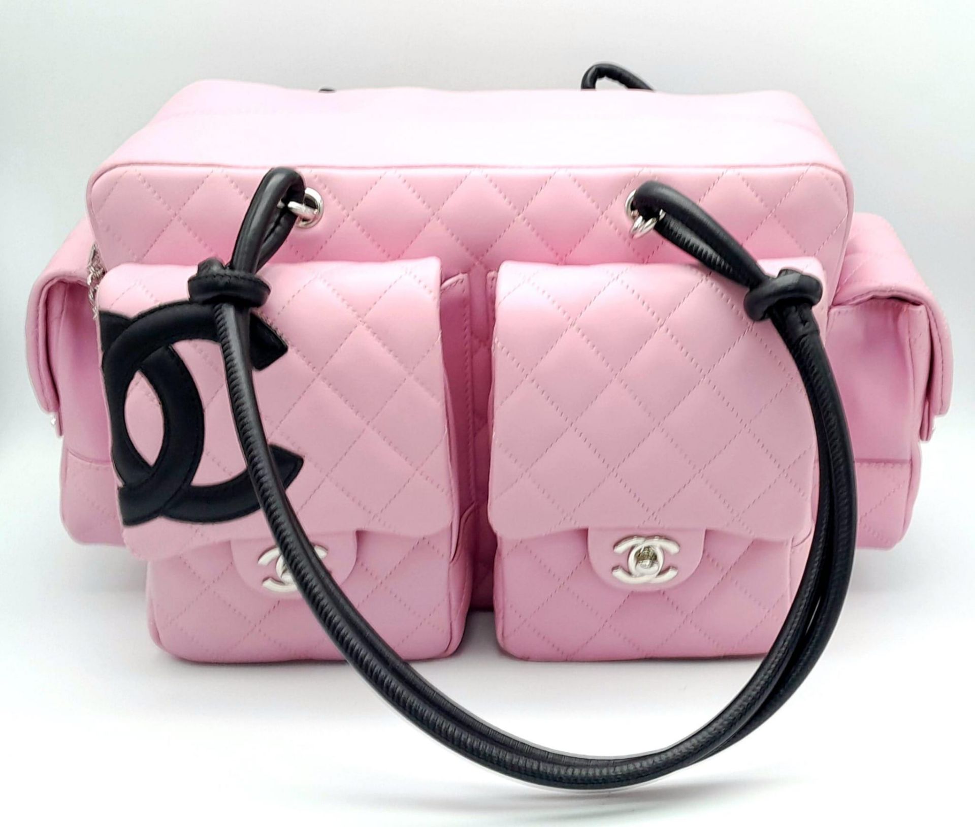 A Chanel Cambon Reporter Barbie Pink Leather Handbag. Quilted pink leather exterior with silver-tone