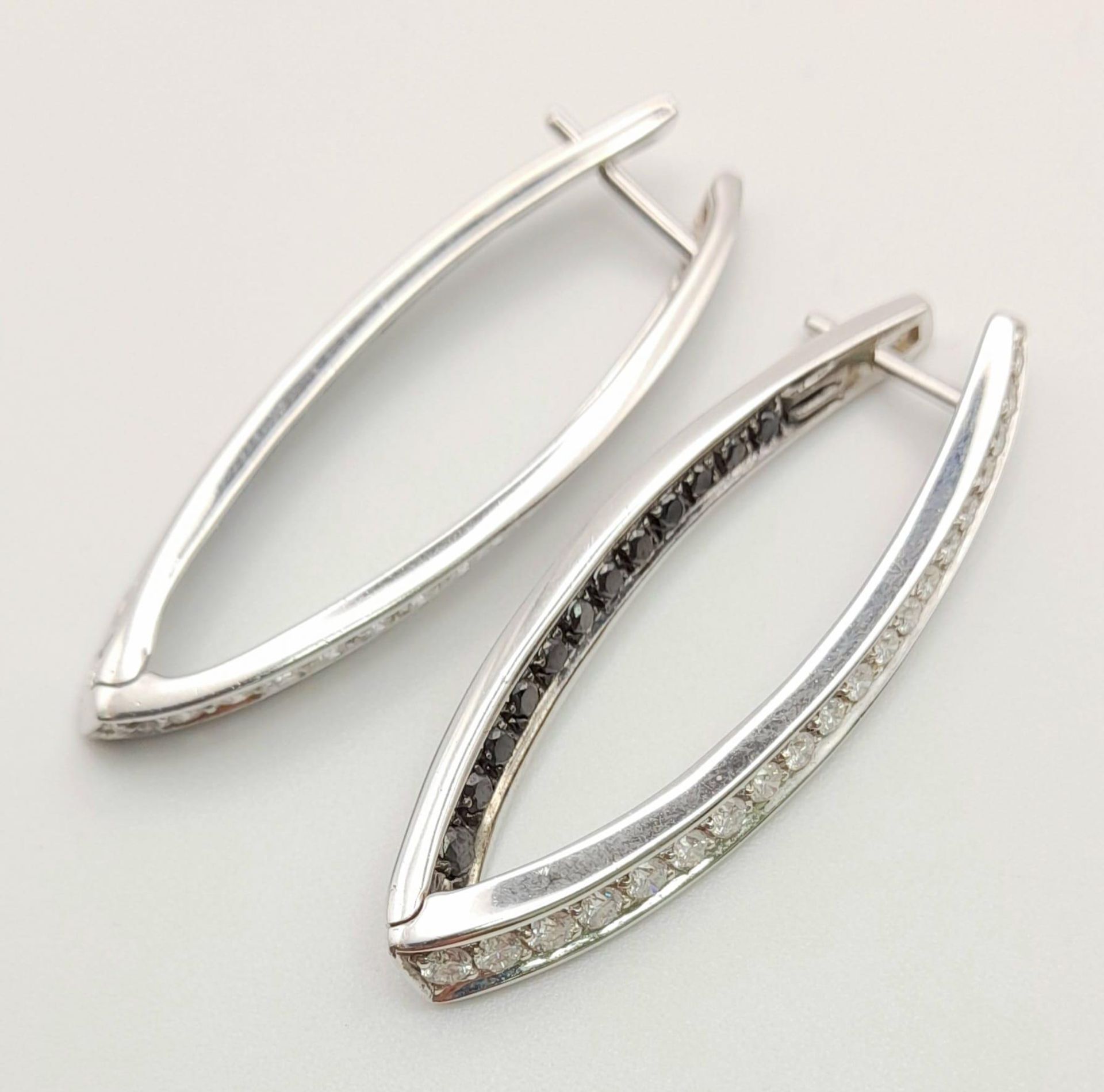A Pair of Designer Palmiero 18K White Gold, Black and White Diamond Elongated Hoop Earrings. 0. - Image 4 of 9