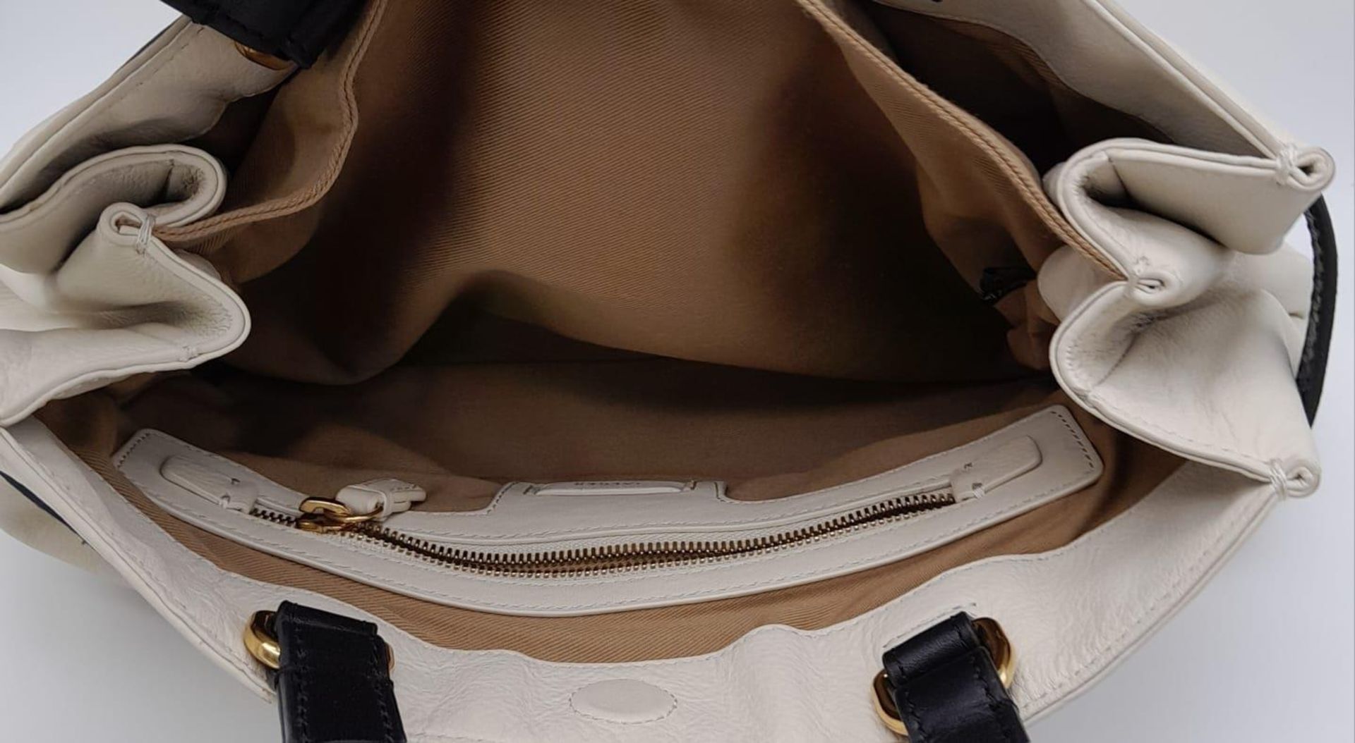 A Jaeger White Leather Handbag. White leather exterior with black leather belt closure and - Image 7 of 8