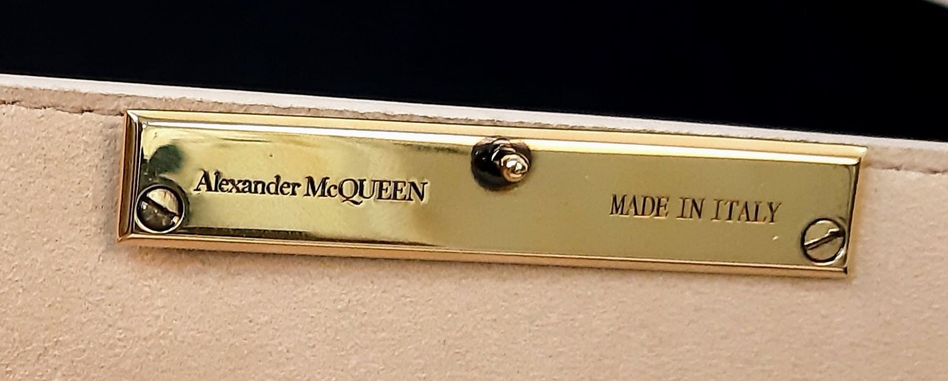 An Alexander McQueen Deep Ivory Leather Clutch Bag with Gold Skull Detail. Beige Suede Interior, - Image 8 of 9