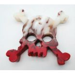 A Flame Agate Hand-Carved Skull and Crossbone Ornament or Paperweight. 8.5cm x 8.5cm.