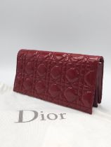 A Christian Dior Red 'Lady Dior' Bag. Cannage quilted patent leather exterior. Magnetic closure,