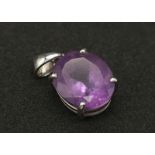 A 9K White Gold Amethyst Pendant. Oval shaped amethyst set in white gold. 1.81g total weight.