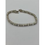 Stunning SILVER TENNIS BRACELET set with 34 PRINCESS CUT CLEAR GEMSTONES. Full UK Hallmark. 19.5 cm.