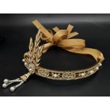 A symbol of 30s “good times”, ART DECO tiara. Gilded with Austrian crystals complete with ribon.