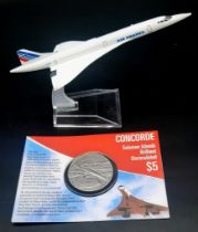 A Vintage Air France Concorde Model Airplane and Commemorative Concorde Coin.