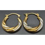 A Pair of Yellow and White Gold Hoop Earrings. 22mm width at base. 1.3g total weight.