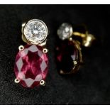 A Pair of 14k Gold, Rhodolite and Diamond Earrings. 0.20ctw diamonds. 1.25g total weight.