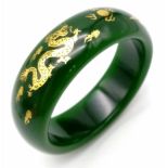 A fashionable, Chinese, spinach green bangle with two gilded celestial dragons, offering glamour and