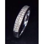 A 9K WHITE GOLD RING WITH ENCRUSTED DIAMOND FRONT . 3.2gms size M