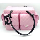A Chanel Cambon Reporter Barbie Pink Leather Handbag. Quilted pink leather exterior with silver-tone