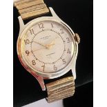 Gentlemans vintage INGERSOLL WRISTWATCH,Finished in gold tone with arrow tipped second hand.
