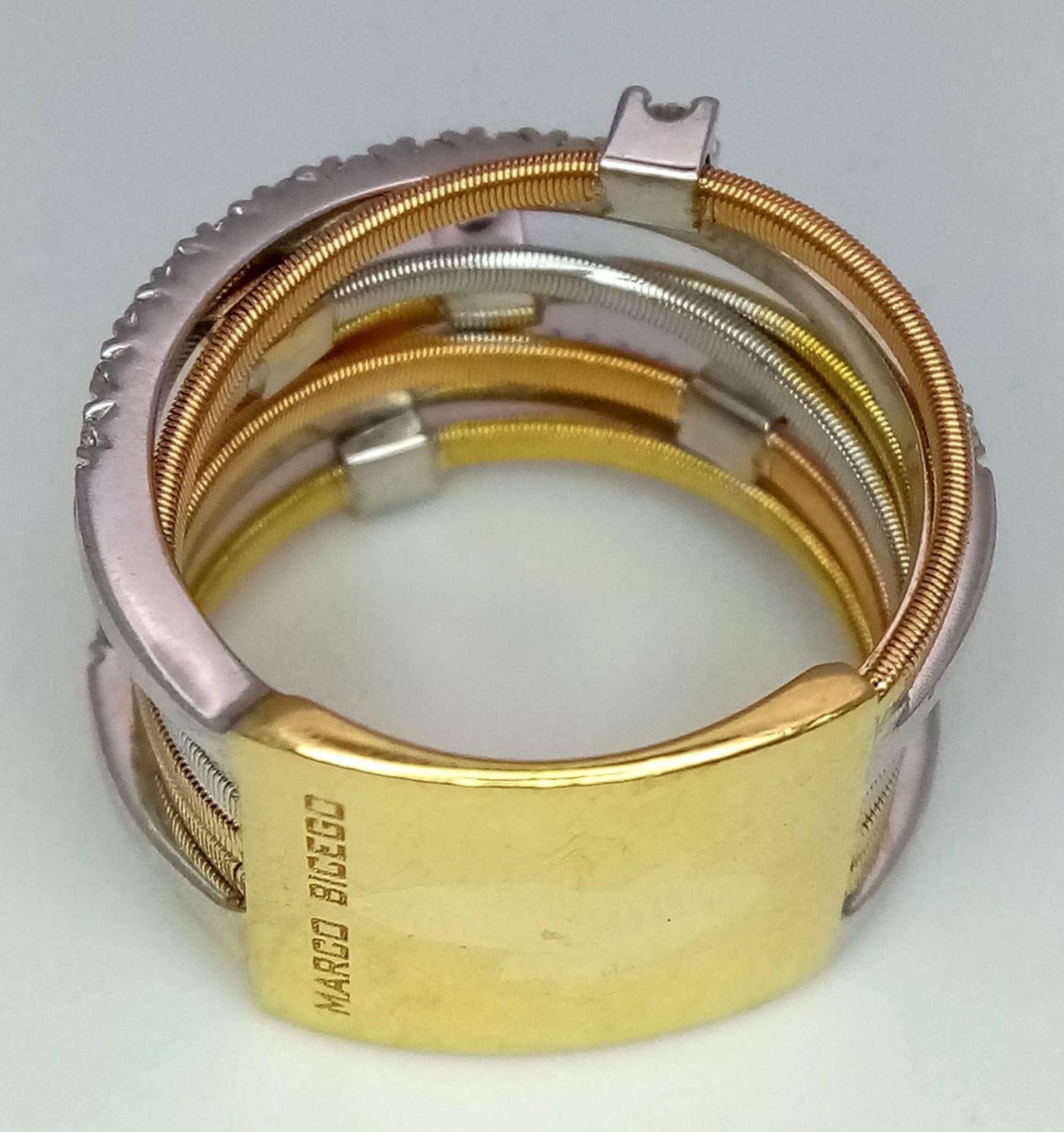 An Italian 18K Yellow and White Gold Diamond Orbital Ring. Front band of gold interspersed with - Bild 7 aus 10