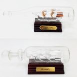 A Pair of Vintage Glass Ships in Bottles of the Bounty & the Santa Maria on Wooden Plinths 23 & 19cm