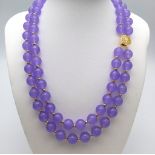 A Beautiful Lavender Jade Two Row Beaded Necklace. 10mm beads with gilded spacers and clasp. 44cm