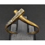A Vintage 9K Yellow Gold Diamond Crossover Ring. Size P. 1.4g total weight.