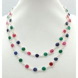 A Ruby, Emerald and Sapphire Long Chain Necklace on 925 Silver. 76cm in length, 28g total weight.