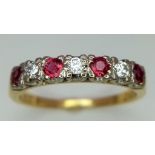 An 18K Gold Ruby and Diamond Seven-Stone Ring. Three brilliant round cut diamonds with ruby