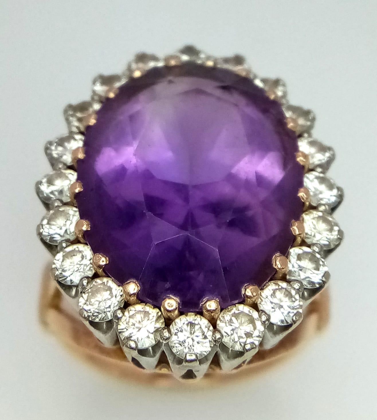 AN 18K YELLOW GOLD DIAMOND & PURPLE STONE ( BELIEVED TO BE AMETHYST ) COCKTAIL RING, WITH A LARGE
