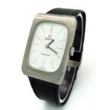 A Classic Vintage Omega Geneve Quartz Watch. Black leather strap. Stainless steel rectangular case -