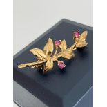 Vintage 9 carat GOLD BROOCH set with RUBIES in the form of a flowering branch. Full UK hallmark. 2.3