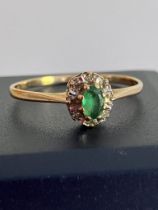 9 carat Yellow GOLD RING set to top with oval cut GREEN TOURMALINE and a WHITE TOPAZ surround.