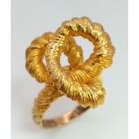 A 9K yellow gold ring with a massive knot (the biggest we have ever seen!), hand crafted by the