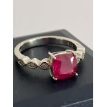Nice quality SILVER RING Having a one carat RUBY SOLITAIRE mounted to top. The Ring having