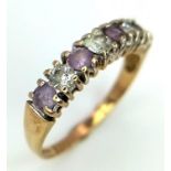 A Vintage 9K Yellow Gold Amethyst and White Stone Ring. Size L. 1.42g total weight.