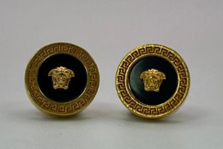 A very desirable VERSACE gold plated stud earrings with the iconic Medusa symbol. Diameter: 11 mm.