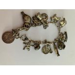 Vintage SILVER CHARM BRACELET With charms to include Penny Farthing, Canoe, Rocking horse, Silver