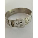 SILVER BUCKLE BRACELET in the form of a Belt with Adjustable Buckle. Attractive chased design.