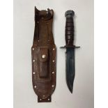 An Ontario Airforce Survival Knife with Leather Scabbard and Sharpening Stone. 27cm length. ML 304