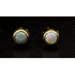 A Pair of 9K Yellow Gold Opal Stud Earrings. 0.86g weight.