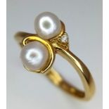 An 18k yellow gold diamond and pearl ring. 2.4g total weight. size L 1/2 (pearls: 2mm/dia:0.01ct).